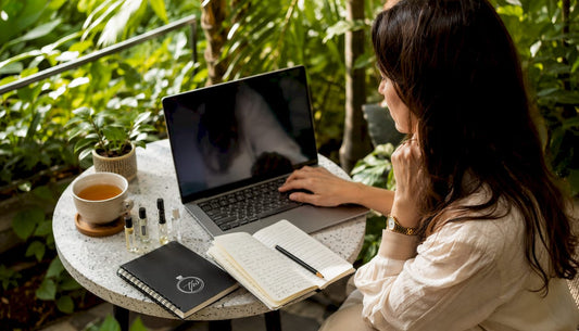 Woman shopping fragrance decants online at home desk