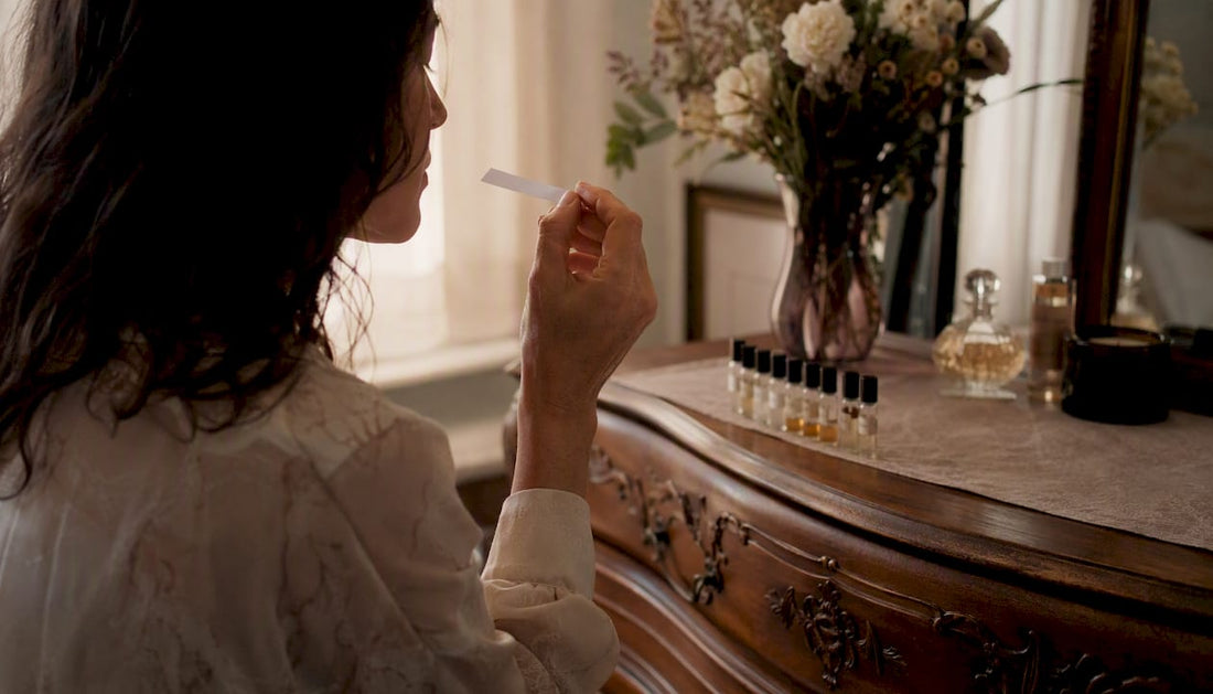 Person smelling perfume blotter