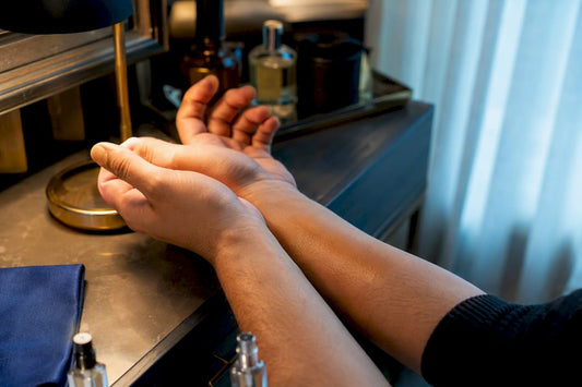 Two wrists comparing fragrance wear