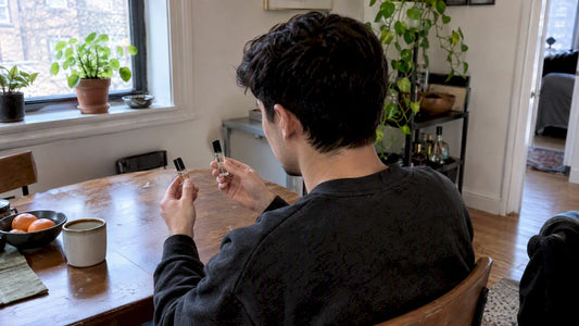 Buyer comparing two perfume decants