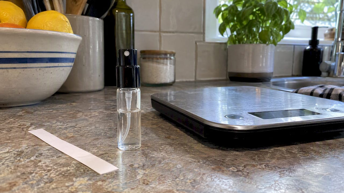 5ml perfume vial beside a kitchen scale
