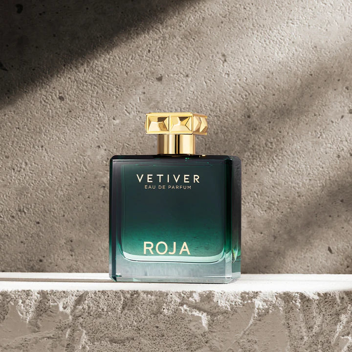Roja Vetiver Eau de Parfum bottle on a concrete surface