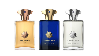 Three Amouage perfume bottles on a white background