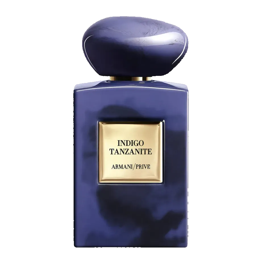 Blue perfume bottle with gold label on a white background. Armani Privé Indigo Tanzanite Eau de Parfum
