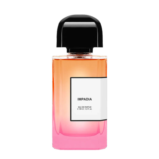 Perfume bottle with gradient design and black cap on a white background