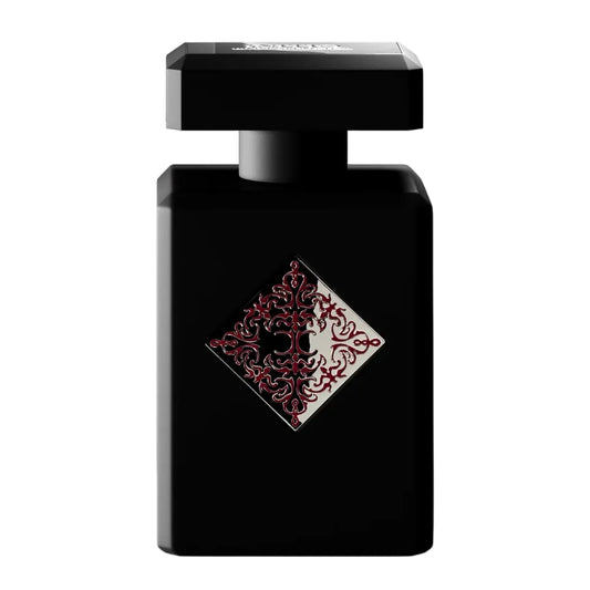 Black perfume bottle with decorative label on a white background