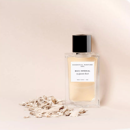 Perfume bottle labeled 'Bois Imperial' on a beige background
