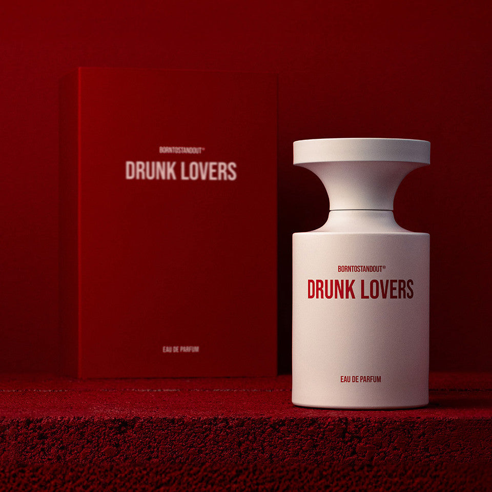 Drunk Lovers perfume bottle and packaging on a red background