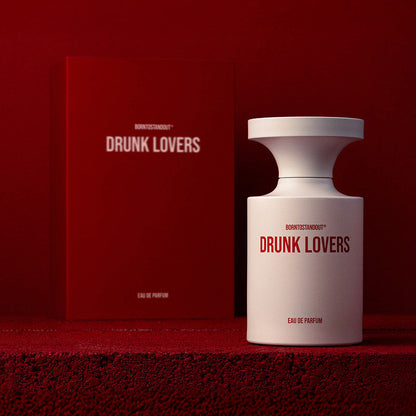 Drunk Lovers perfume bottle and packaging on a red background