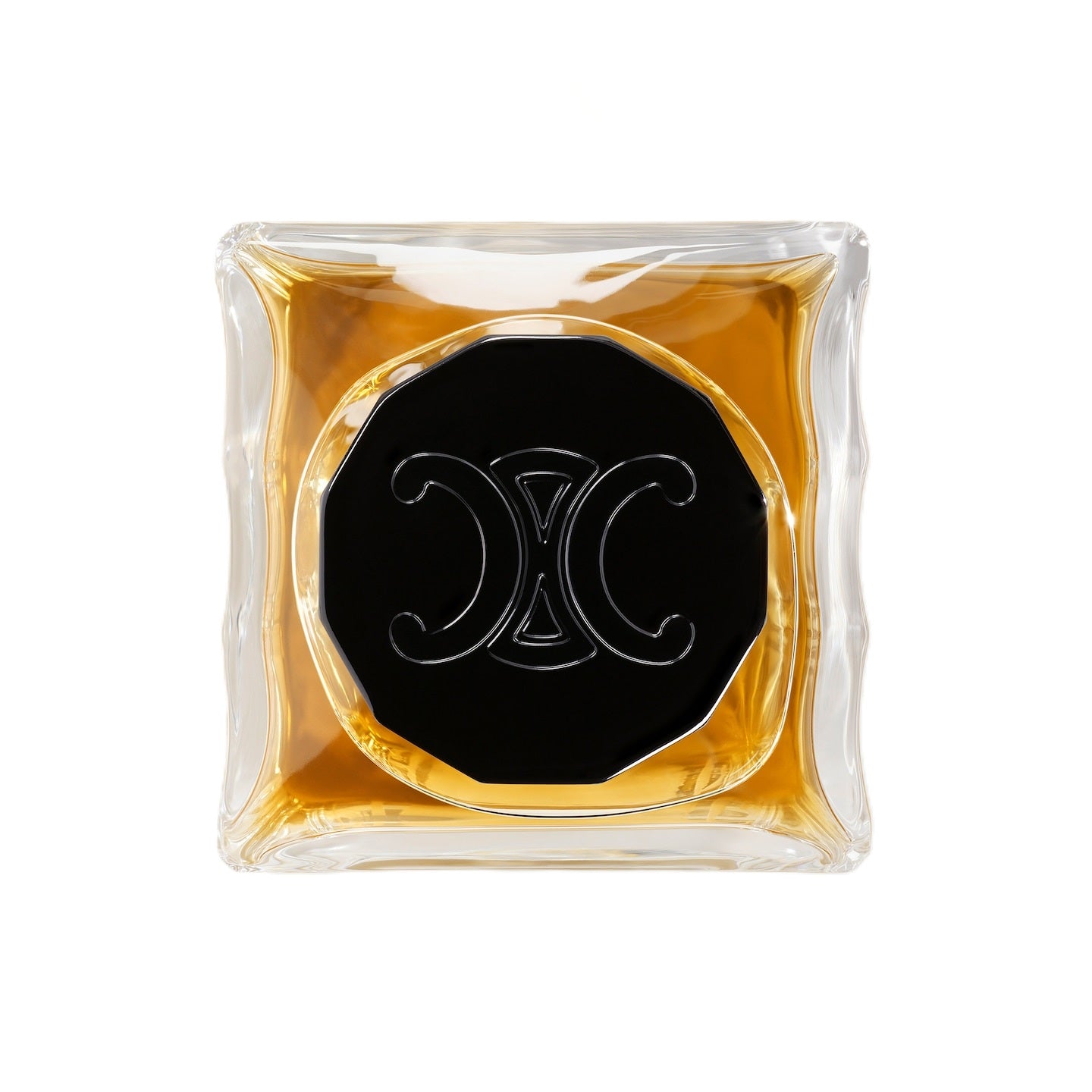 Cosmetic compact with black center and gold border on a white background