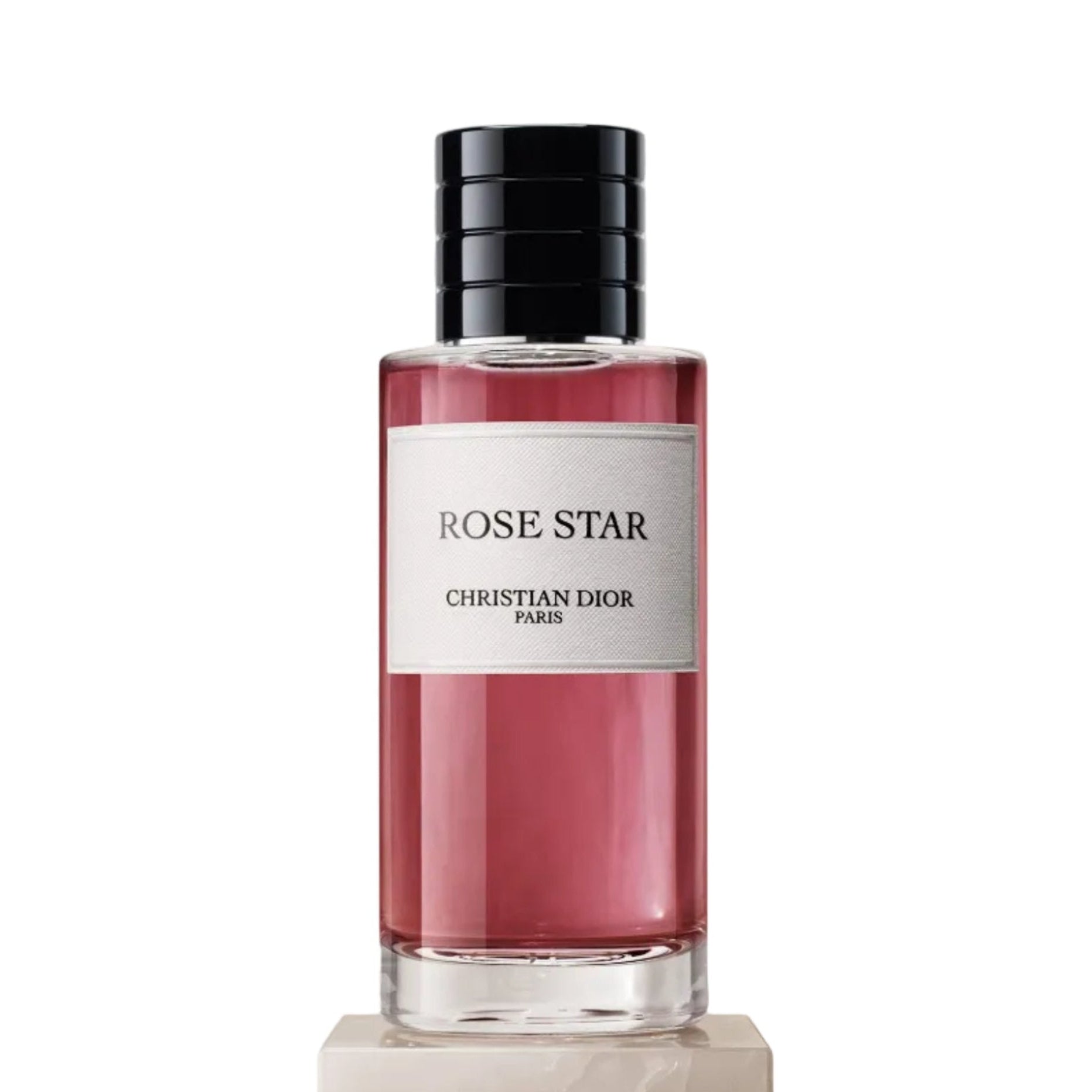 Perfume bottle labeled 'Rose Star' by Christian Dior on a light background