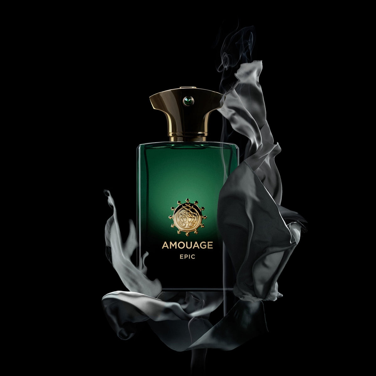 Amouage Epic perfume bottle in deep green glass with a gold crest and gold lettering, set against a solid black background with dramatic white smoke swirls.