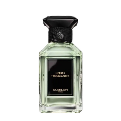 Guerlain perfume bottle with black cap on a white background