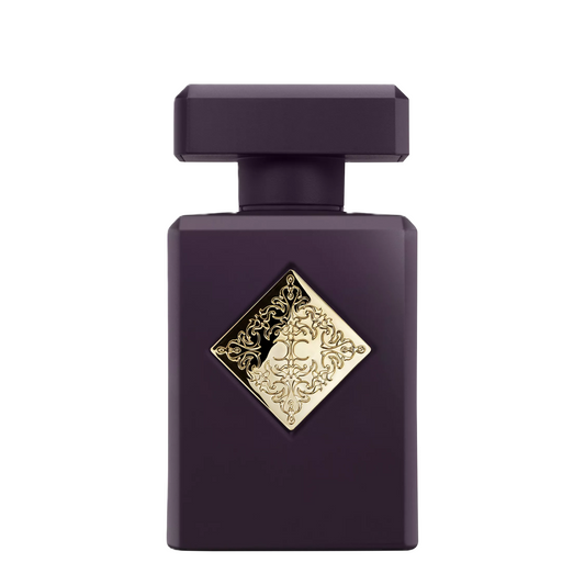 A dark purple rectangular perfume bottle with a matching cap and a decorative gold diamond-shaped emblem on the front, centered on a plain white background.