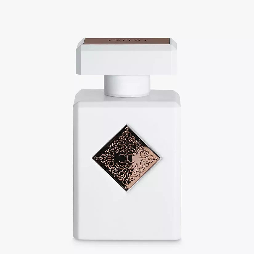 White perfume bottle with a decorative label on a white background