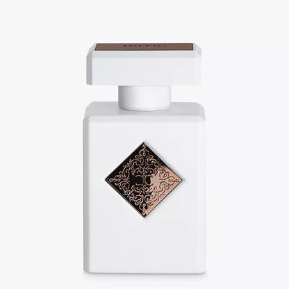 White perfume bottle with a decorative label on a white background
