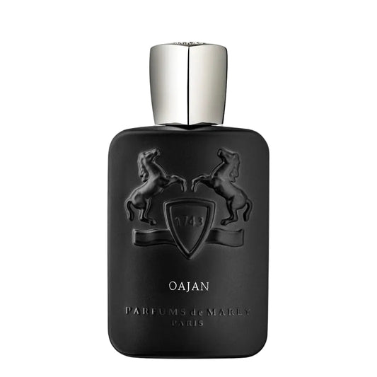 Black perfume bottle with silver cap on a white background