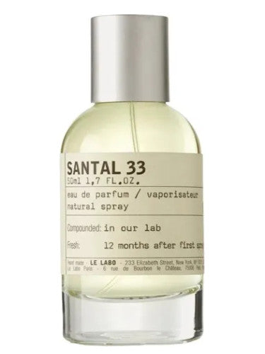 A bottle of Le Labo Santal 33 Eau De Parfum with a white label and silver cap.