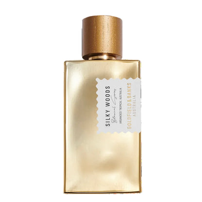 Gold perfume bottle with wooden cap on a white background
