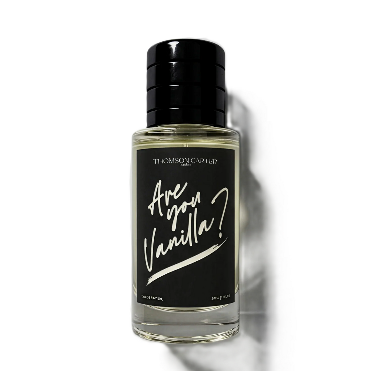 A clear glass bottle of THOMAS & CAUGHTER 'Are You Vanilla?' fragrance with a black cap and black label, shown on a white background with a soft shadow.