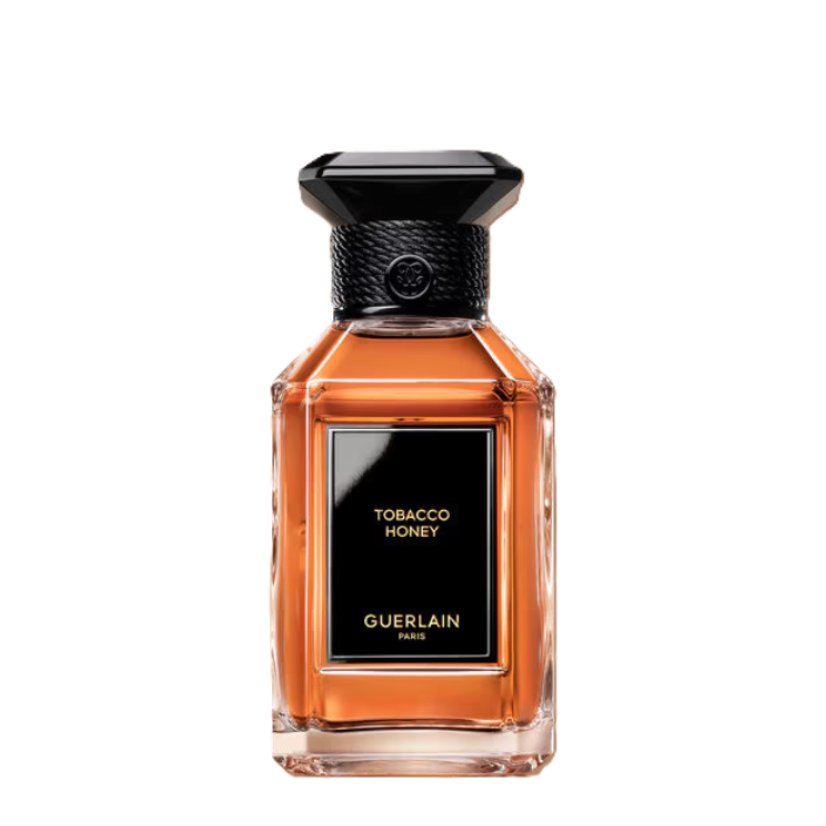 Guerlain Tobacco Honey perfume bottle with amber-colored liquid, a black label, and a black cap, centered on a plain white background.