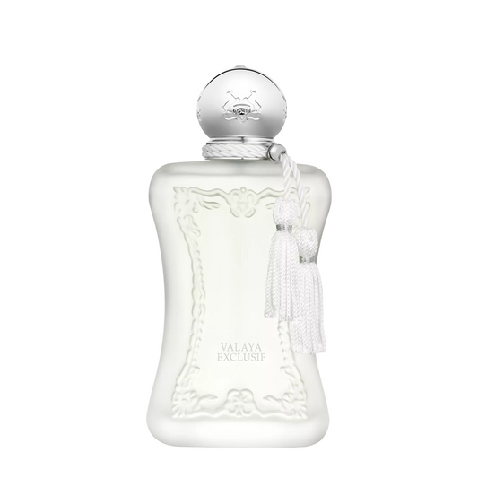 A frosted glass perfume bottle with a silver spherical cap and white tassel, labeled Valaya Exclusif, on a plain white background.