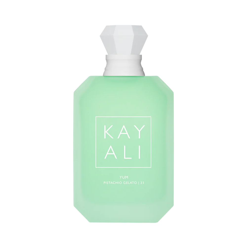 Green perfume bottle with white cap on a white background