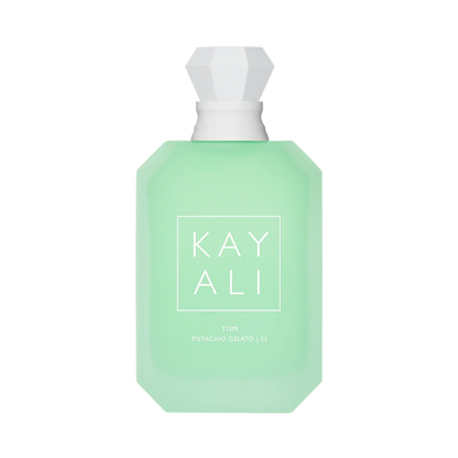 Green perfume bottle with white cap on a white background